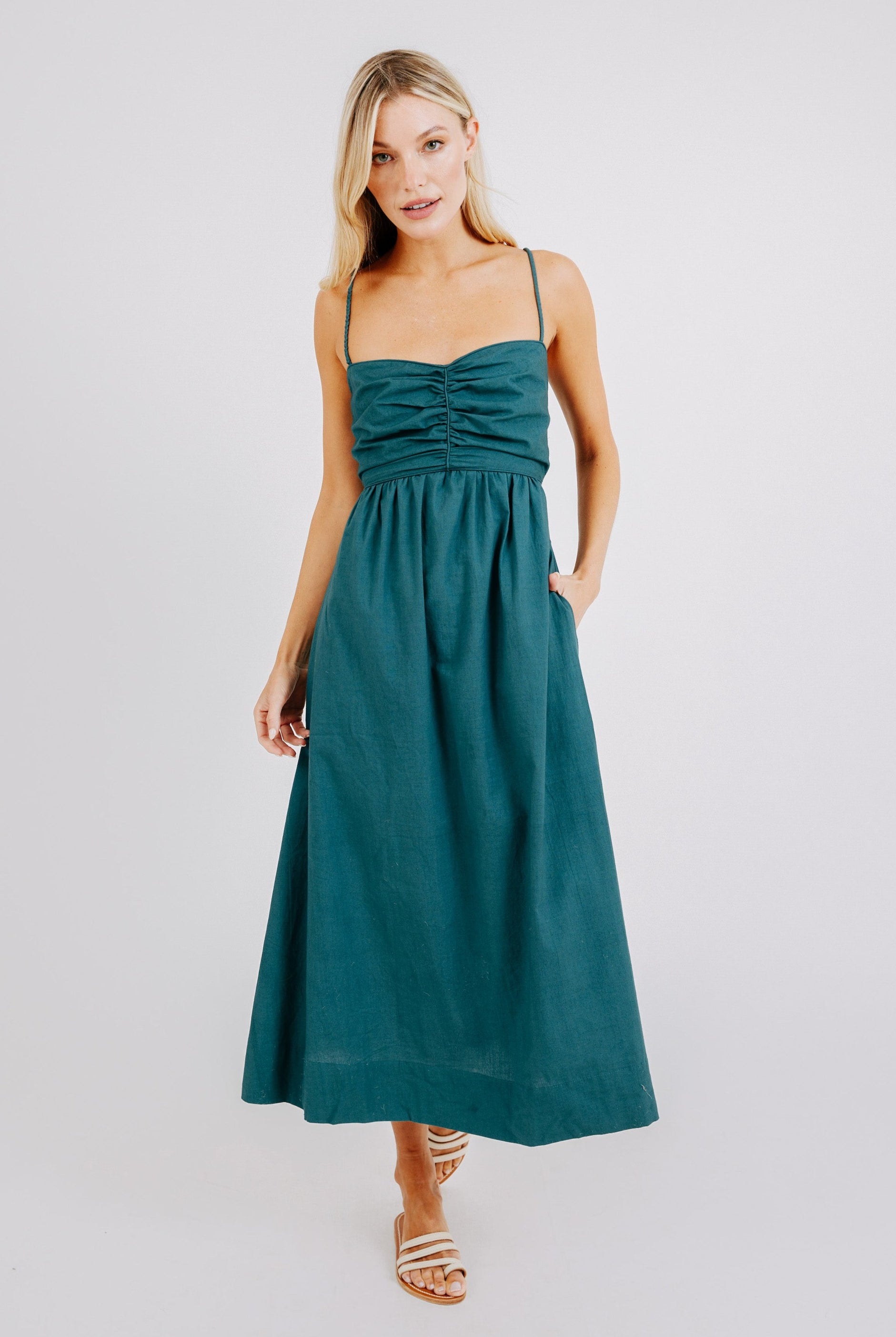 Girl wearing MIRTH women's tie back cutout deia midi sundress in spruce green poplin