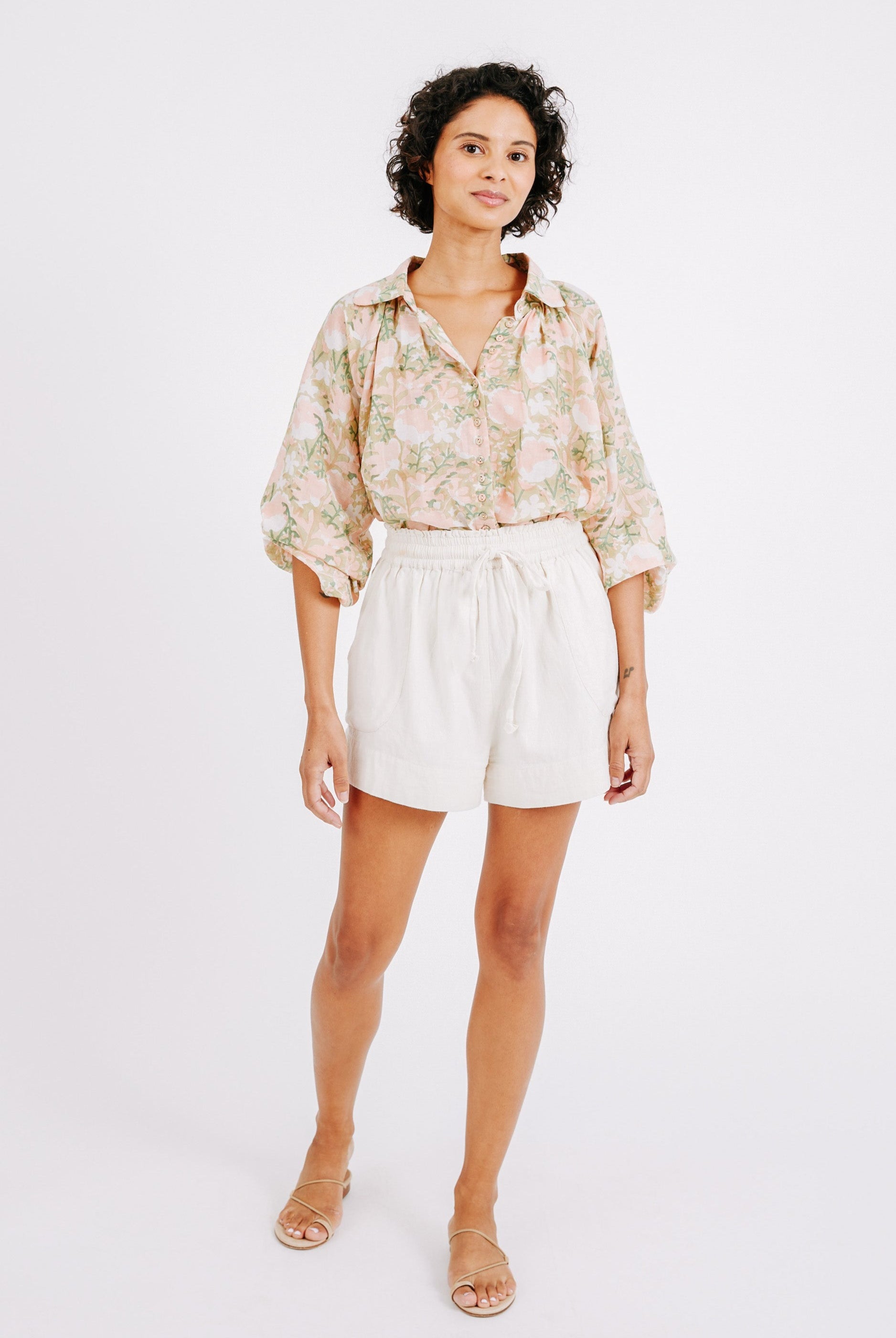 Girl wearing MIRTH women's elastic drawstring woodstock cotton wide leg shorts with pockets in bone cream