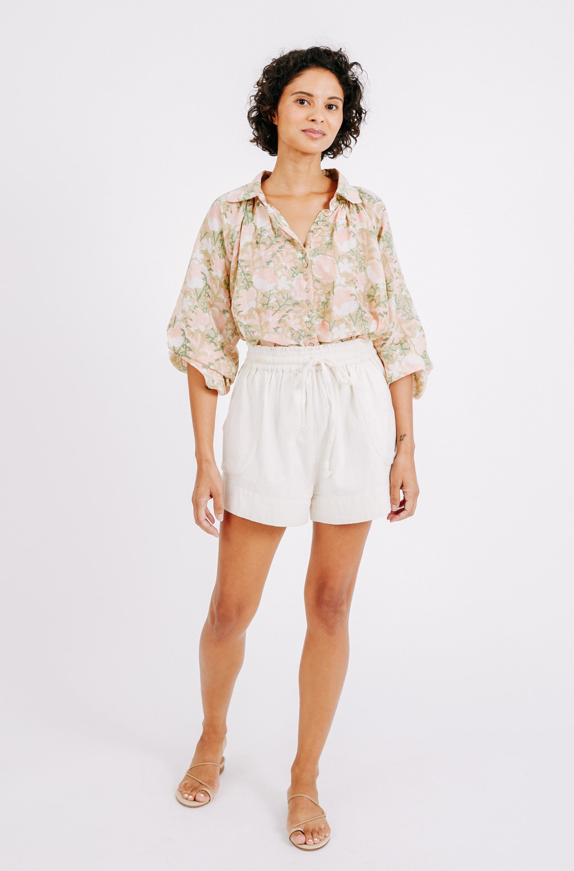 Girl wearing MIRTH women's elastic drawstring woodstock cotton wide leg shorts with pockets in bone cream