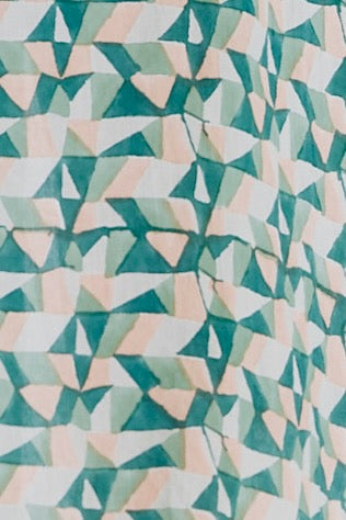 Girl wearing MIRTH women's smocked elastic waist cropped granada top set in seaglass green