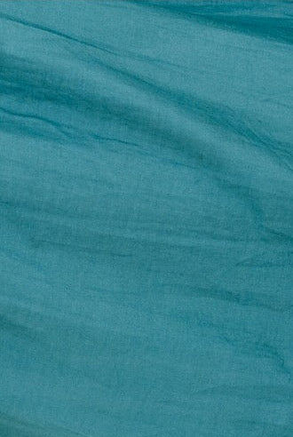 Girl wearing MIRTH women's long tiered gathered short sleeve vienna maxi dress in spruce green cotton silk with tie belt