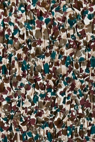 Girl wearing MIRTH women's long sleeve smocked elastic shoreditch top in purple red amaryllis print