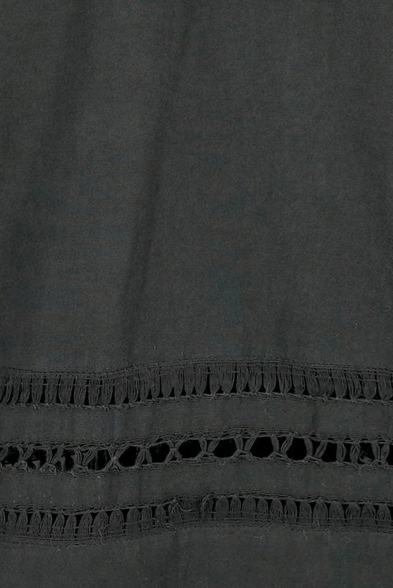 Girl wearing MIRTH women's fringe cutout quarter sleeve sintra top in black cotton