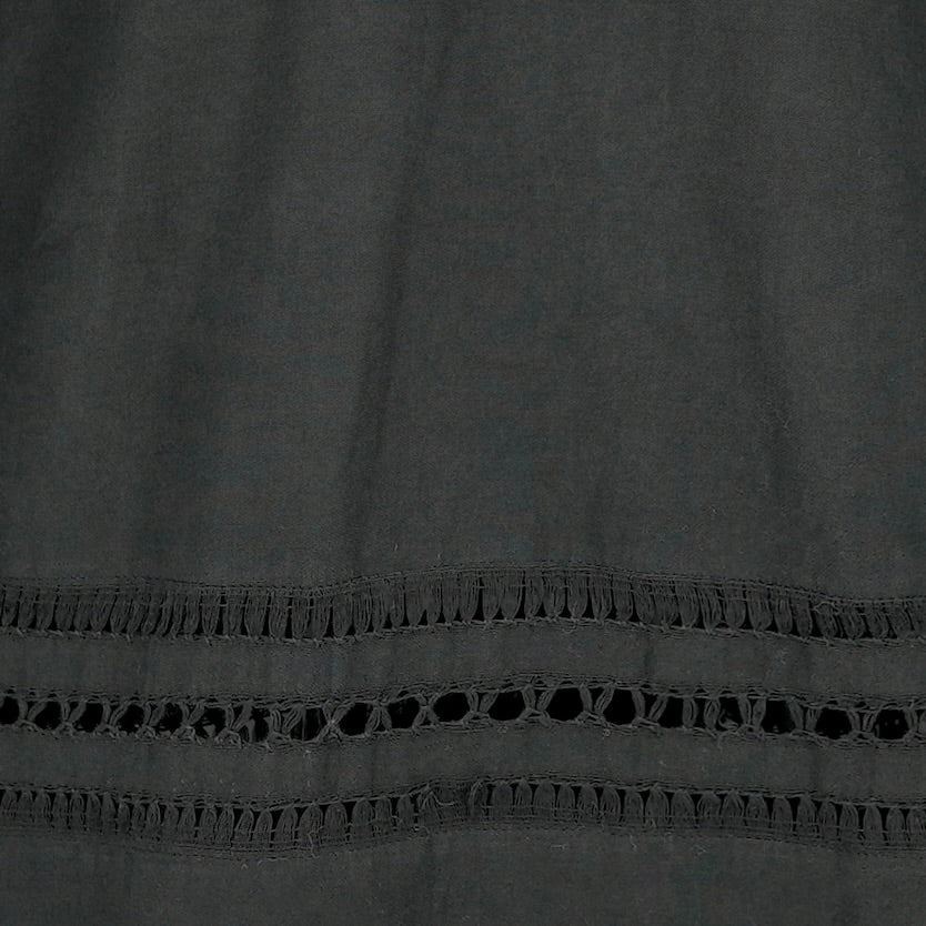 Girl wearing MIRTH women's fringe cutout quarter sleeve sintra top in black cotton