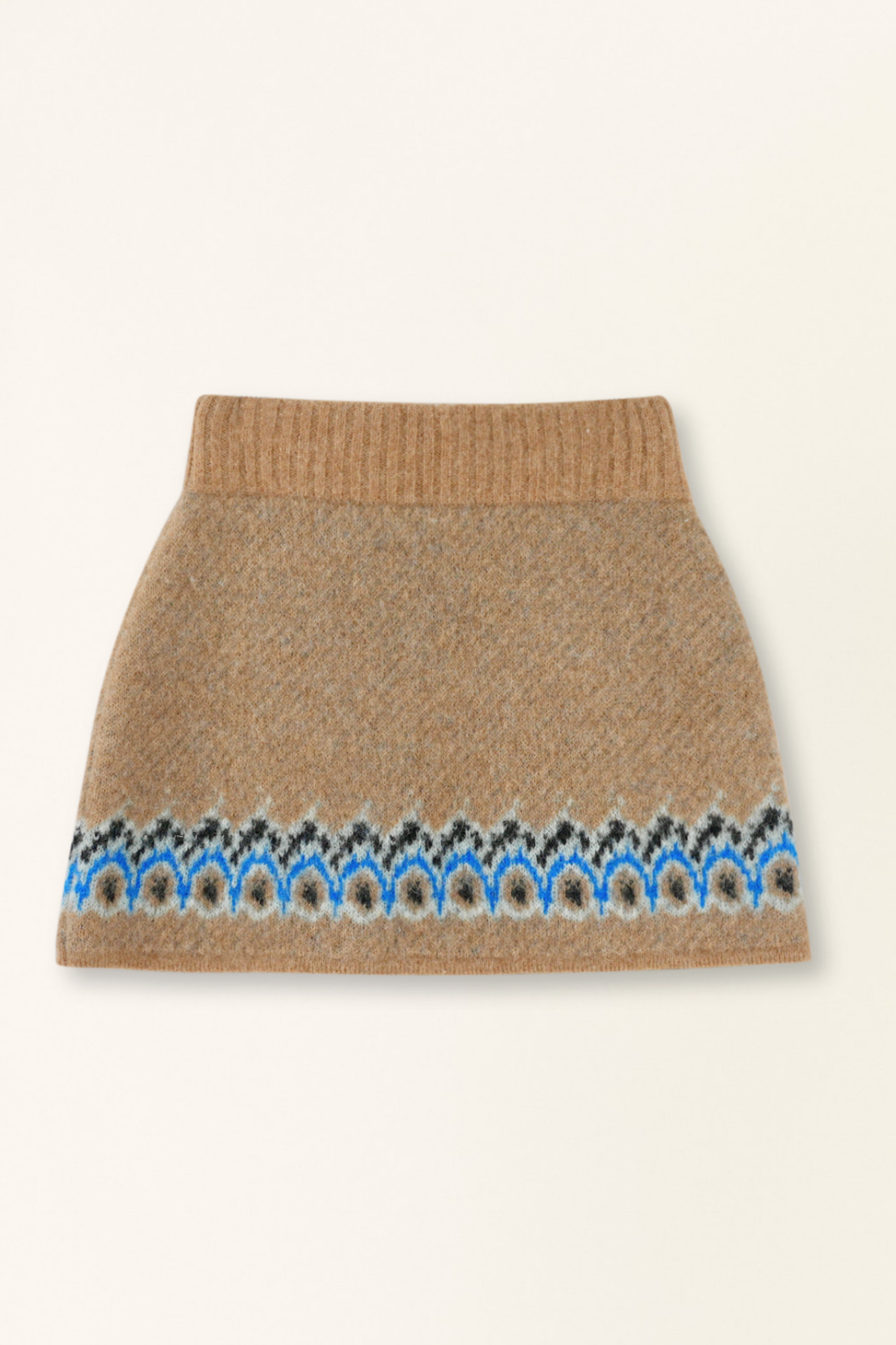 Knitted skirt with a patterned hem on a beige background