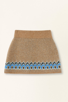 Knitted skirt with a patterned hem on a beige background