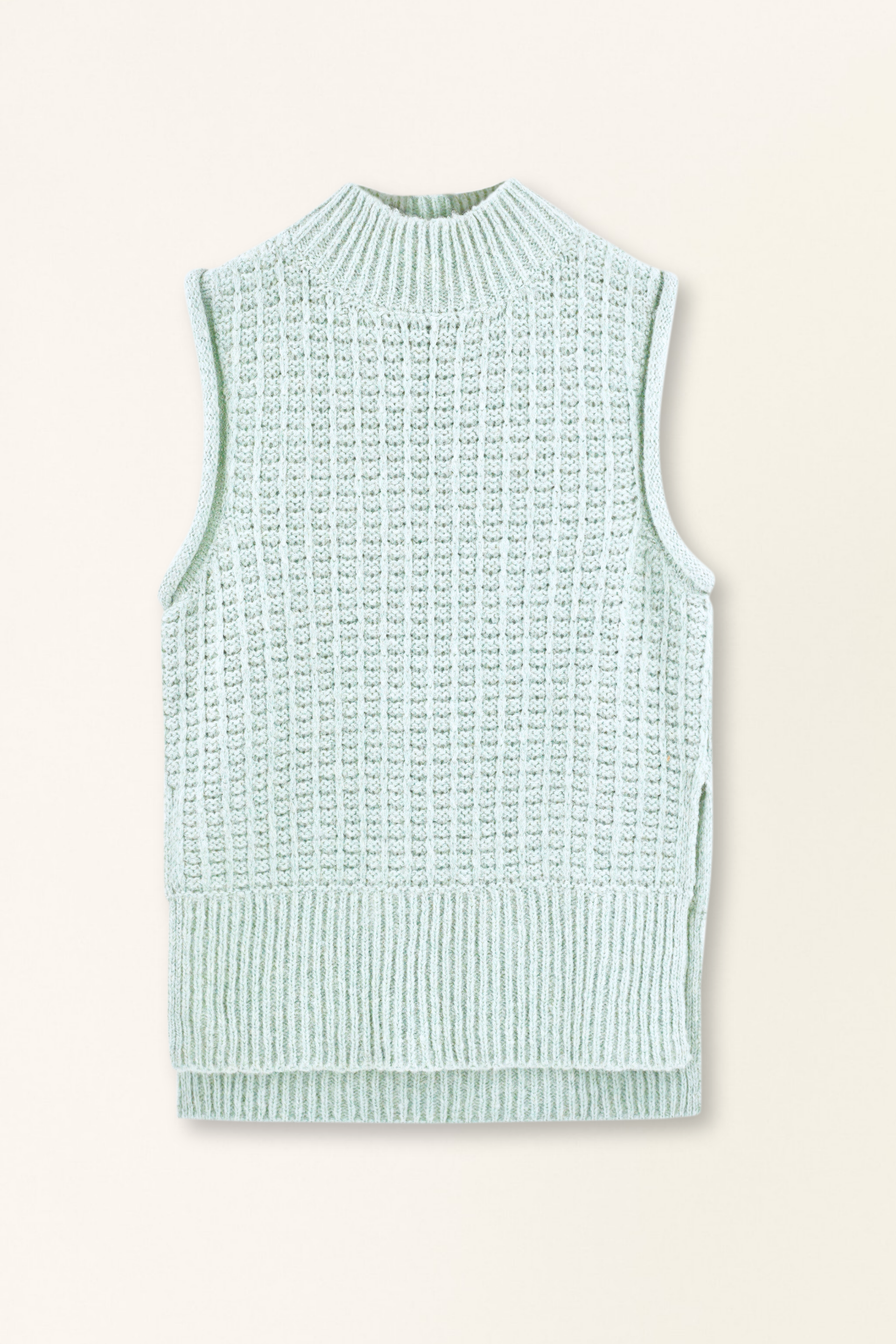 Light blue sleeveless knitted vest on a beige background