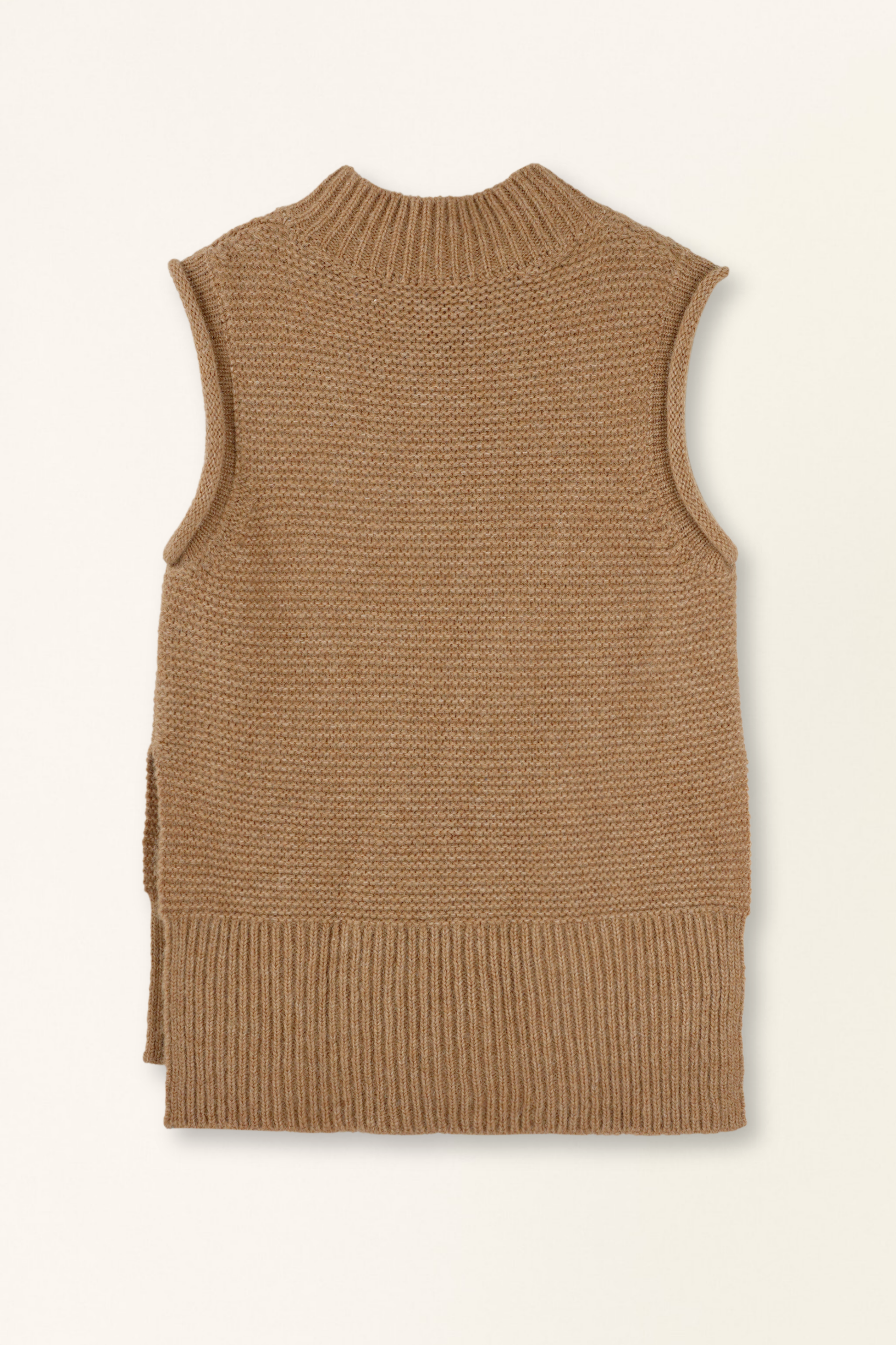 Brown knitted vest on a light beige background