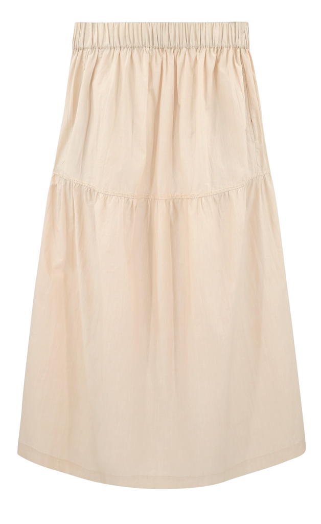 Girl wearing MIRTH women's elastic waist tiered brighton long skirt in parchment cream cotton poplin