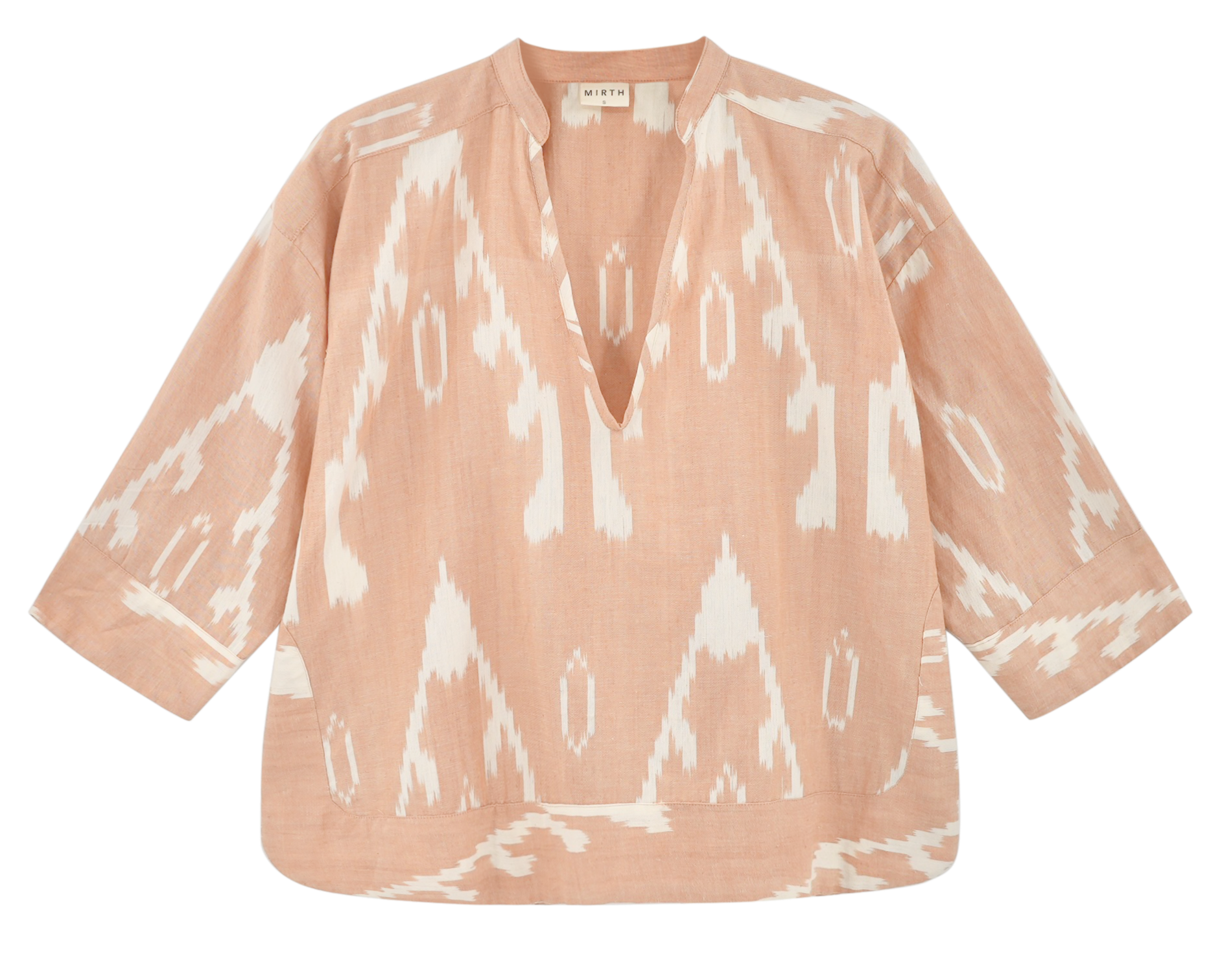 Girl wearing MIRTH women's v neck three quarter sleeve camden top in peach conch ikat handloomed cotton