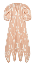 Girl wearing MIRTH women's puff sleeve v neck scallop hem cassis long dress in conch ikat peach cotton