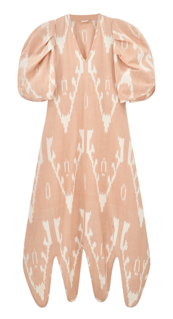 Girl wearing MIRTH women's puff sleeve v neck scallop hem cassis long dress in conch ikat peach cotton