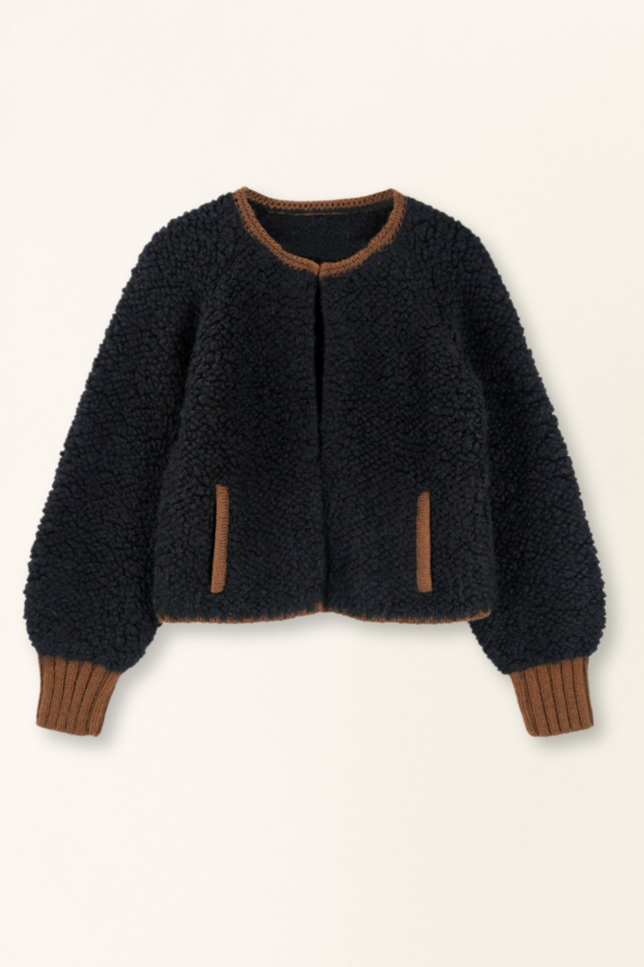 Dark blue textured jacket with brown trim on a beige background