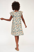 Girl wearing MIRTH women's v neck short sleeve komodo short dress in plumeria blue floral print cotton