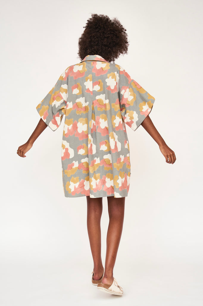 Girl wearing MIRTH women's v neck collared three quarter sleeve lanai short dress in waterlily print cotton