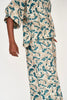 Girl wearing MIRTH women's v neck collared three quarter sleeve lanai top in plumeria blue floral print cotton