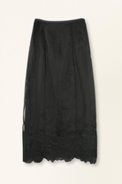 Black skirt with lace hem on a white background