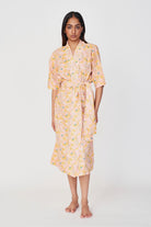 Girl wearing MIRTH women's laos cotton bathrobe in pink lemonade cotton