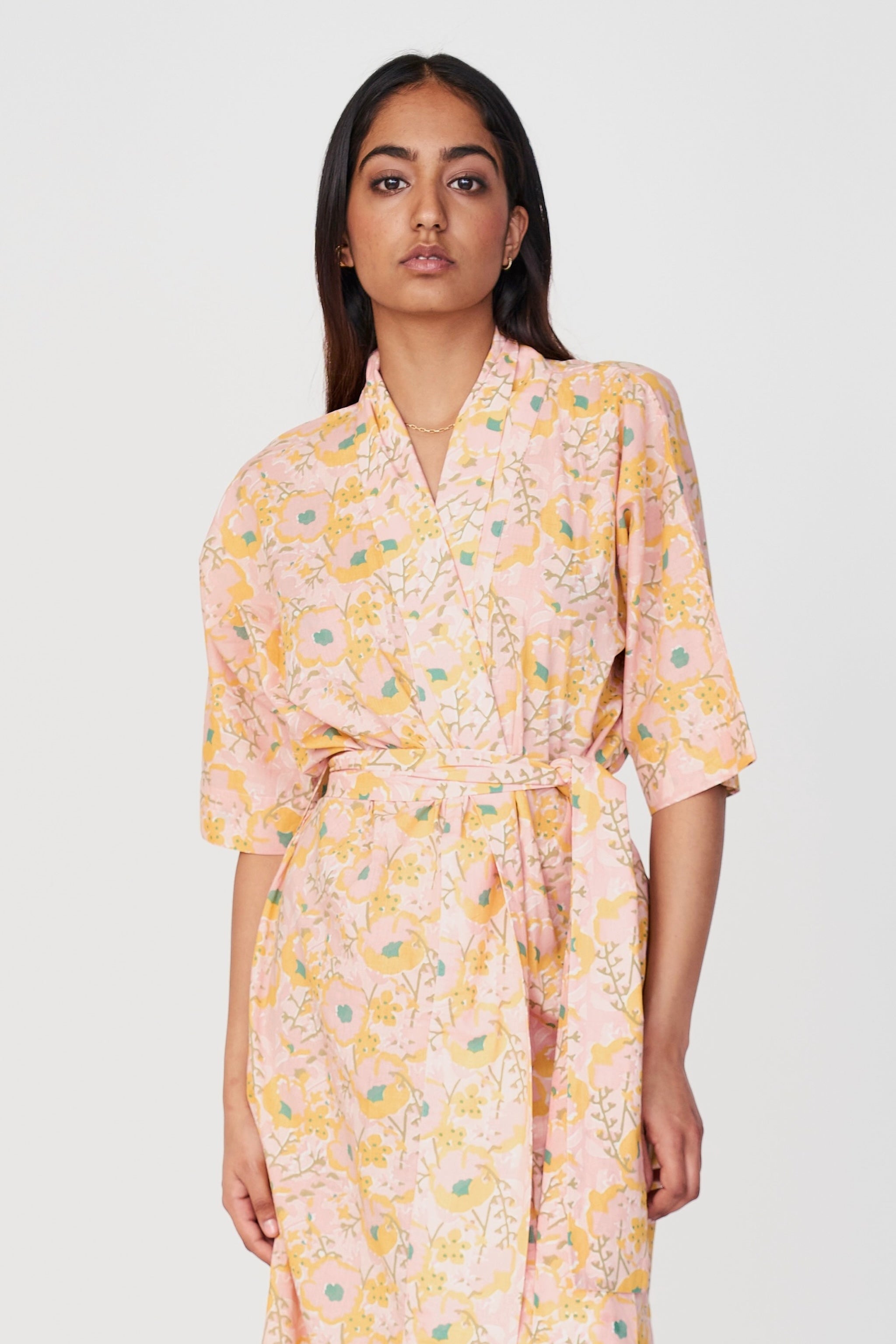 Girl wearing MIRTH women's laos cotton bathrobe in pink lemonade cotton