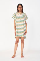 Girl wearing MIRTH women's short nightgown dress in jawbreaker green cotton