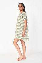 Girl wearing MIRTH women's short nightgown dress in jawbreaker green cotton