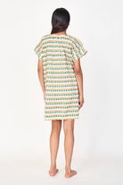 Girl wearing MIRTH women's short nightgown dress in jawbreaker green cotton