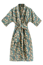 Girl wearing MIRTH women's laos cotton bathrobe in onyx bloom floral cotton silk