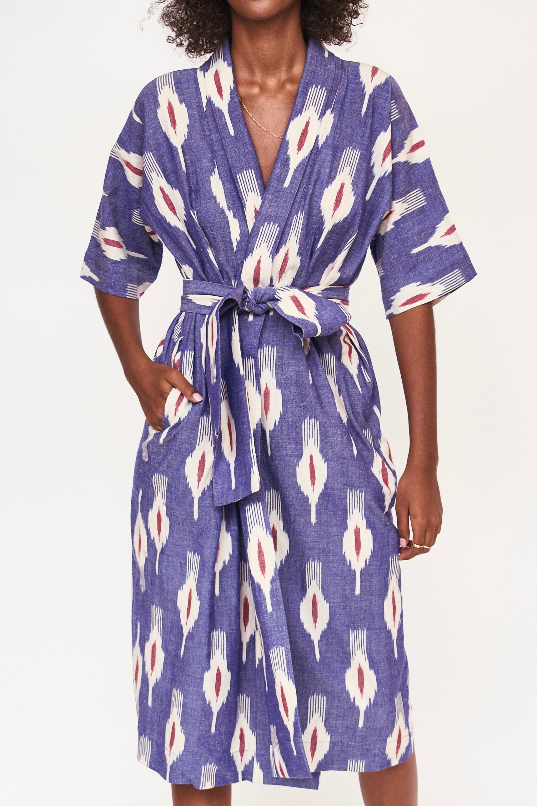 Girl wearing MIRTH women's laos cotton bathrobe in nautical ikat blue cotton