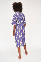 Girl wearing MIRTH women's laos cotton bathrobe in nautical ikat blue cotton