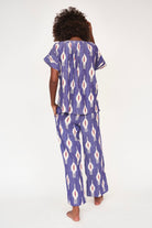 Girl wearing MIRTH women's short sleeve pajama pant set in nautical ikat blue cotton