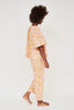 Girl wearing MIRTH women's short sleeve pajama pant set in pink lemonade cotton