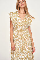 Girl wearing MIRTH women's v neck layered pintuck sleeveless long belted laguna dress in driftwood brown print cotton