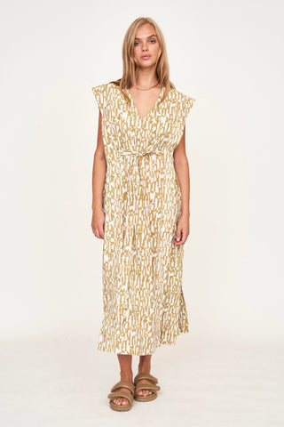 Girl wearing MIRTH women's v neck layered pintuck sleeveless long belted laguna dress in driftwood brown print cotton