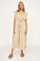 Girl wearing MIRTH women's v neck layered pintuck sleeveless long belted laguna dress in driftwood brown print cotton