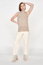 Girl wearing MIRTH women's knit aspen high neck open side vest in camel brown wool