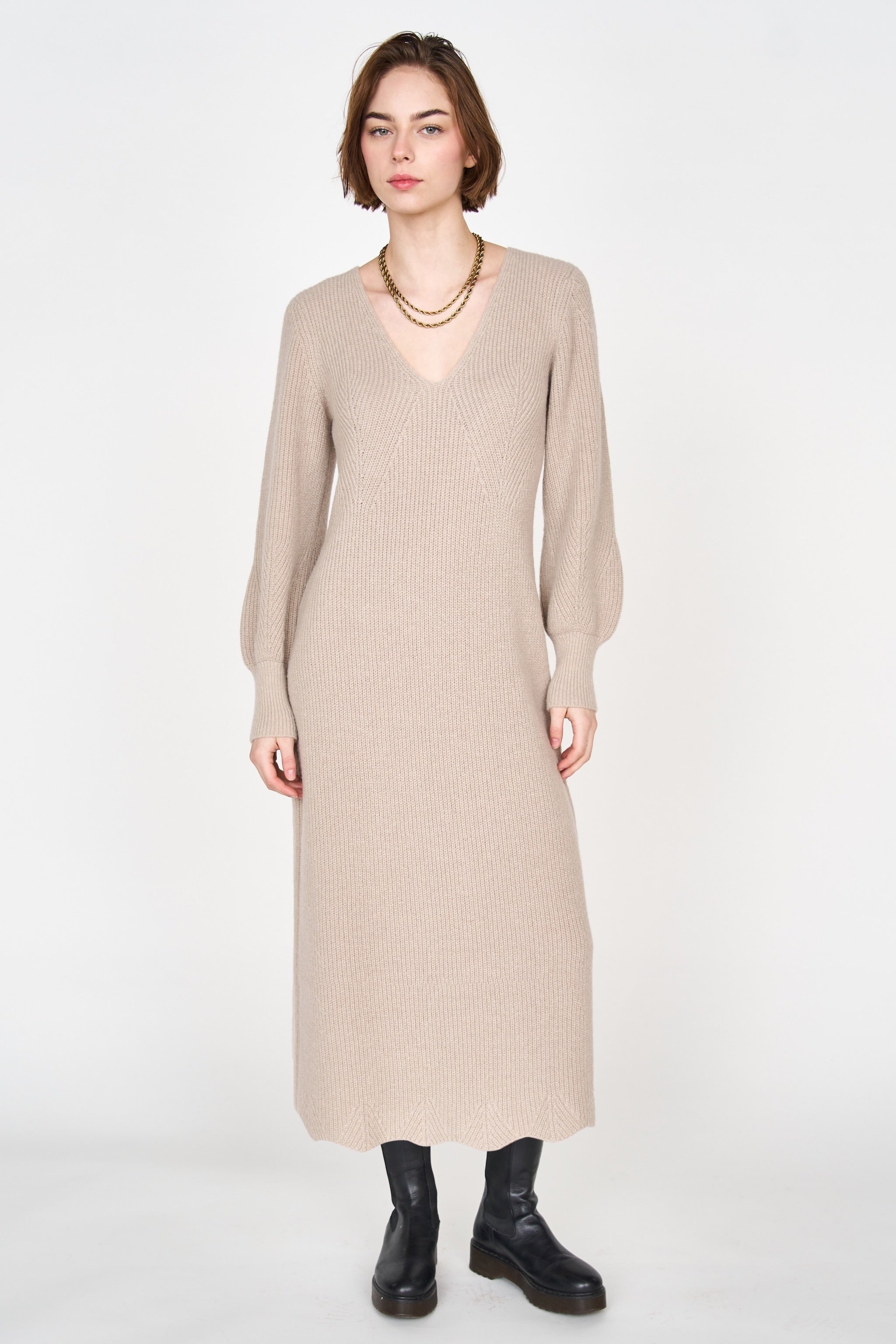 Girl wearing MIRTH women's knit v neck bellagio sweater dress in taupe brown wool