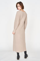 Girl wearing MIRTH women's knit v neck bellagio sweater dress in taupe brown wool