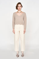 Girl wearing MIRTH women's knit v neck bellagio sweater in taupe brown wool