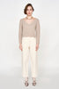 Girl wearing MIRTH women's knit v neck bellagio sweater in taupe brown wool