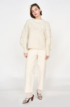 Girl wearing MIRTH women's knit cusco pullover sweater in ivory white wool