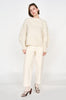 Girl wearing MIRTH women's knit cusco pullover sweater in ivory white wool