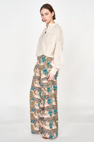 Girl wearing MIRTH women's button up smocked lightweight florence blouse in hand woven ivory jamdani cotton