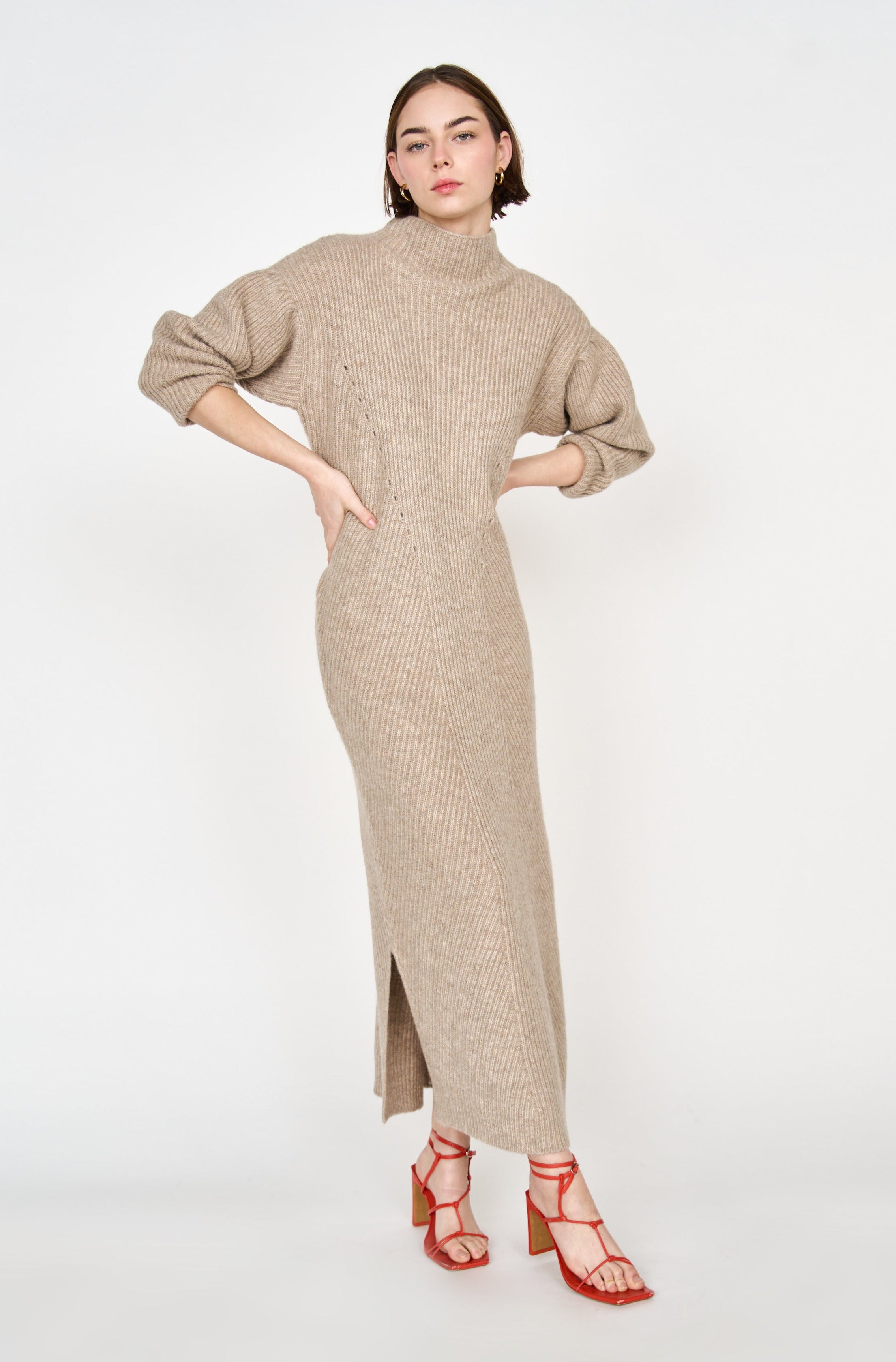 Girl wearing MIRTH women's knit pichu pichu sweater dress in camel brown wool