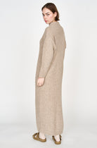 Girl wearing MIRTH women's knit pichu pichu sweater dress in camel brown wool