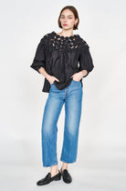 Girl wearing MIRTH women's pullover rosette rosenberg blouse in black cotton silk