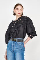 Girl wearing MIRTH women's pullover rosette rosenberg blouse in black cotton silk