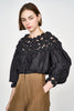 Girl wearing MIRTH women's pullover rosette rosenberg blouse in black cotton silk