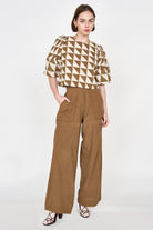 Girl wearing MIRTH women's high waist tivot pant in tannin brown cotton