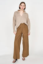 Girl wearing MIRTH women's high waist tivot pant in tannin brown cotton