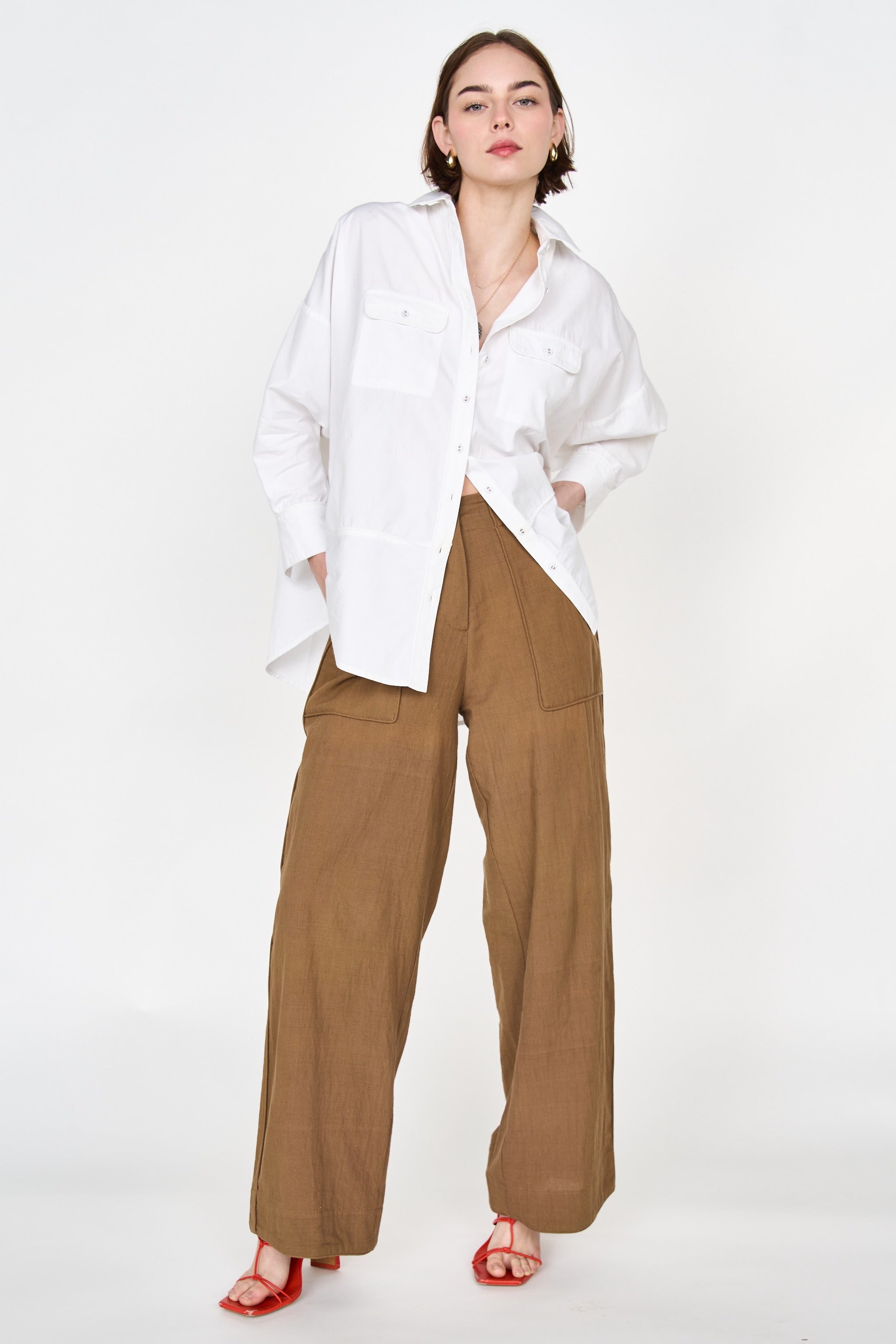 Girl wearing MIRTH women's high waist tivot pant in tannin brown cotton